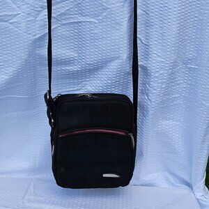 Travelon Brand cross body travel bag with many compartments black w pink inside